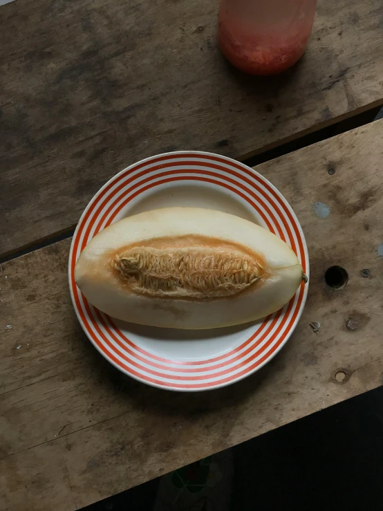 there is a plate with an apple and bread on it