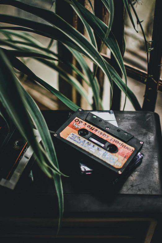 a table with an old cassette sitting on top of it