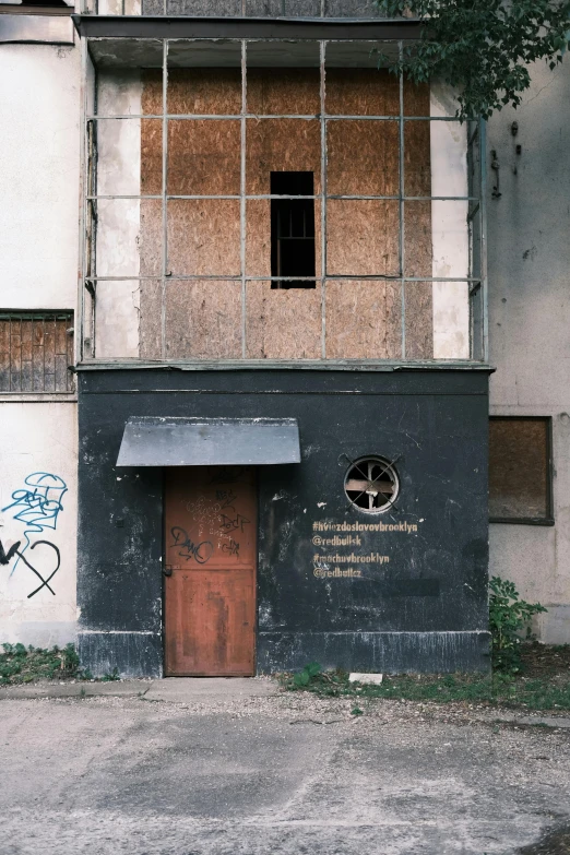 an old building that is dirty and very boarded up