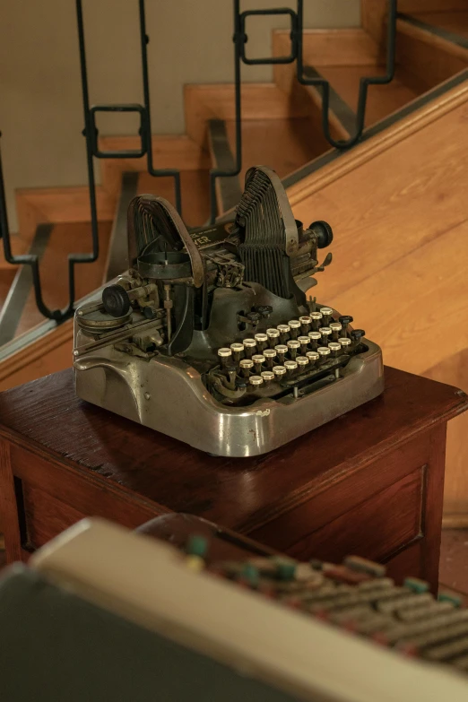 a desk with a keyboard, mouse, and remote