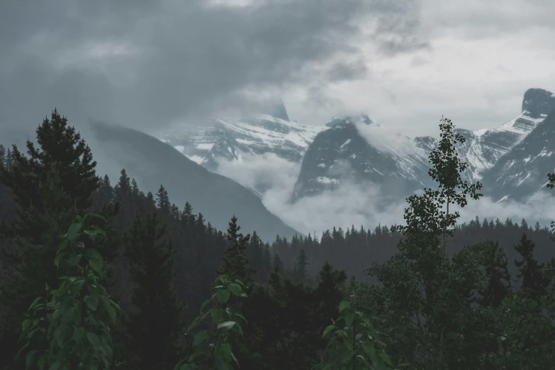 a mountain view during the day, and it's cloudy