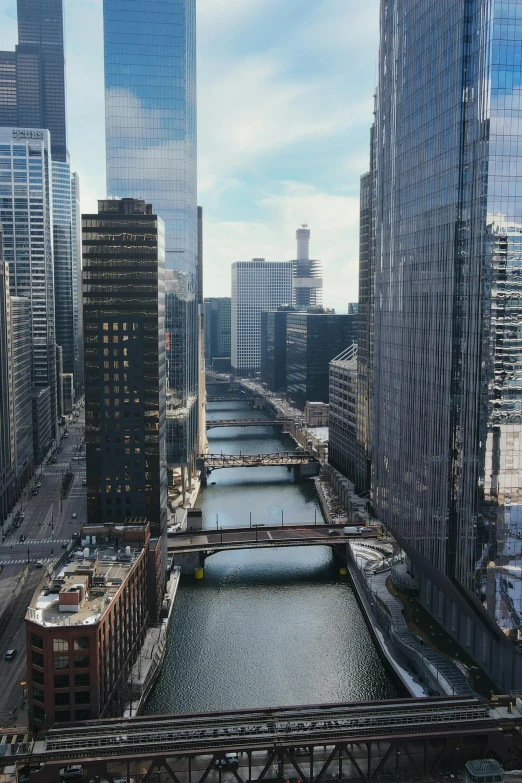 a river flowing between tall buildings on either side