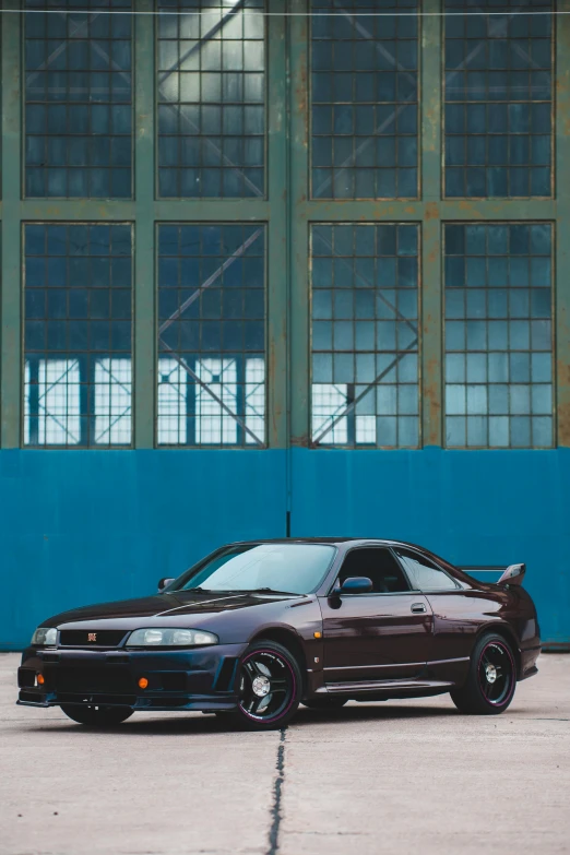 a car parked next to an empty parking lot