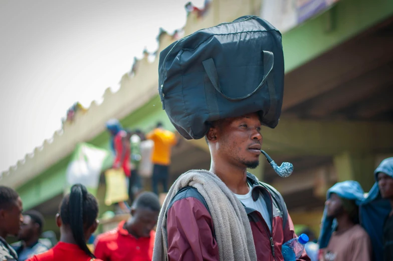 a man with a bag on his head standing