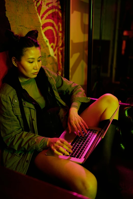 a woman that is sitting on a red chair