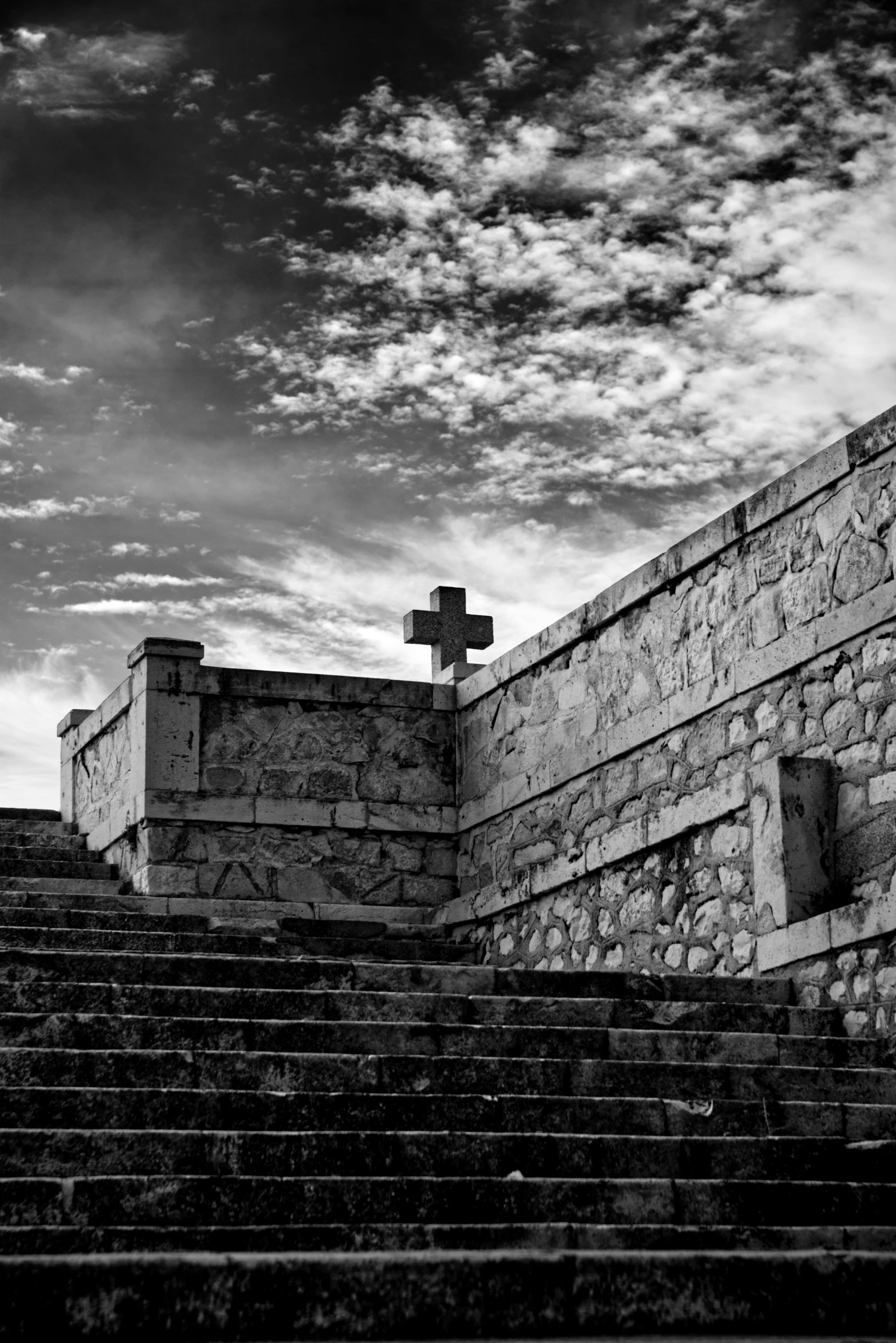 the cross on the top of the hill stands alone