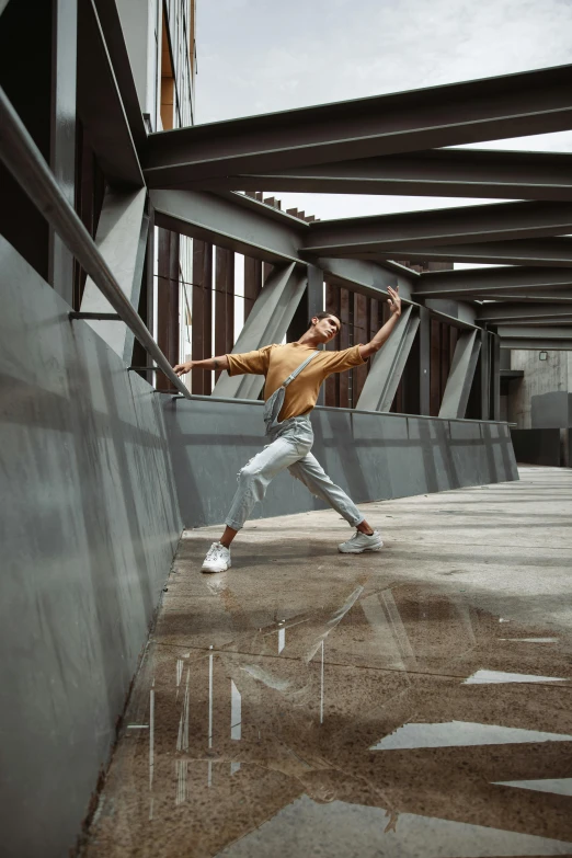 a man dressed in silver pants with a jacket is performing tricks