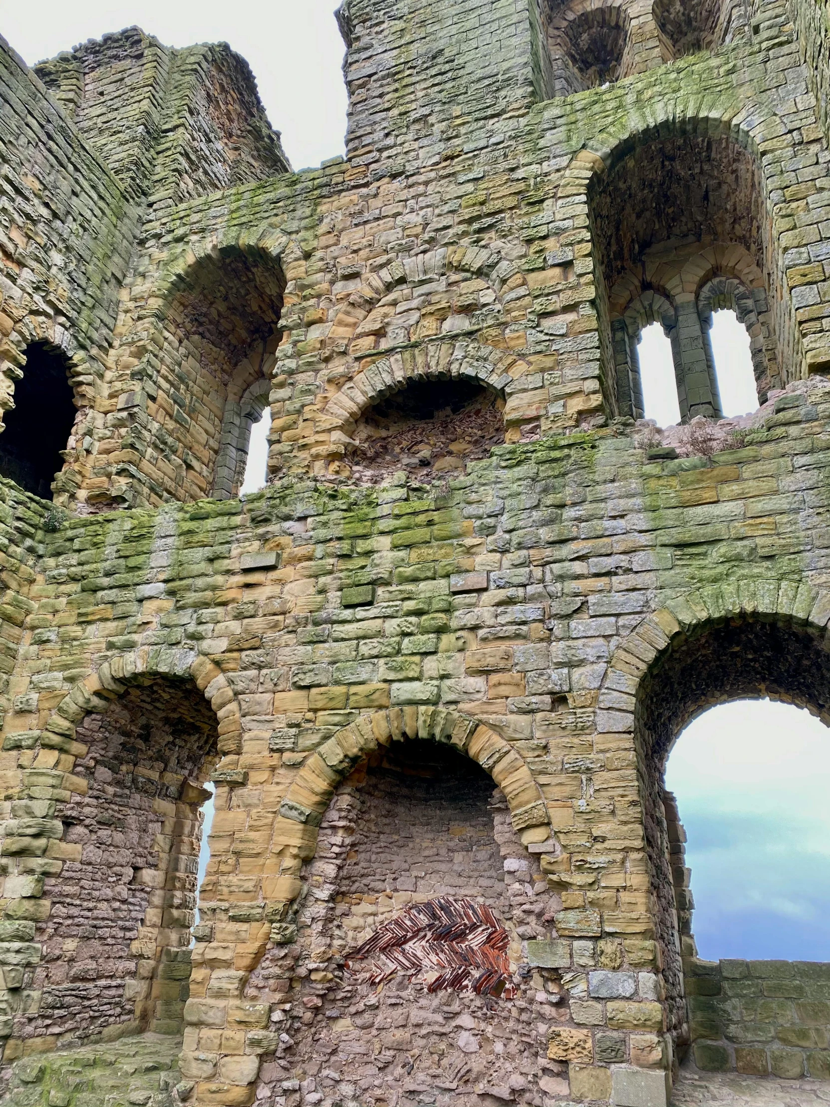 a po taken through a stone wall with arches