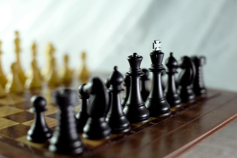 a wooden chess board and game set with pieces