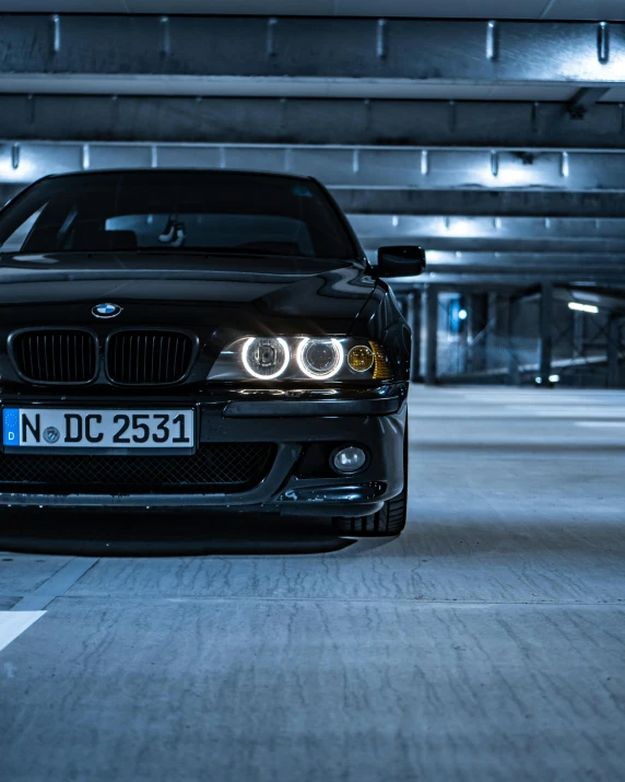 this is an image of a bmw in a parking garage