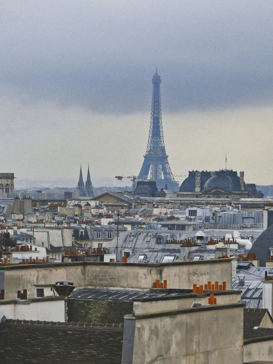 the city skyline has many different buildings with the eiffel tower in the background