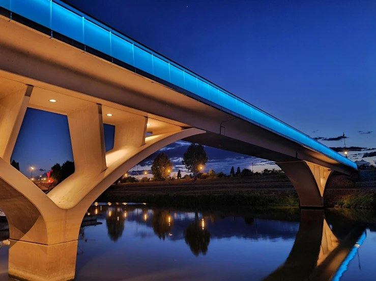 a lite up bridge spanning over water