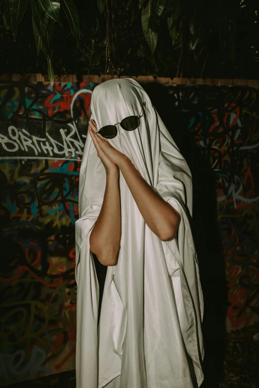 a person wearing a white veil covering their face