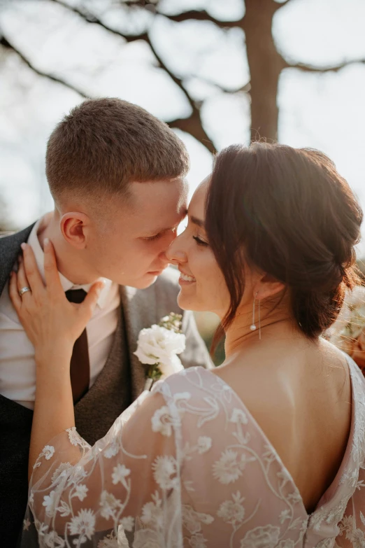 a couple in formal attire standing close together