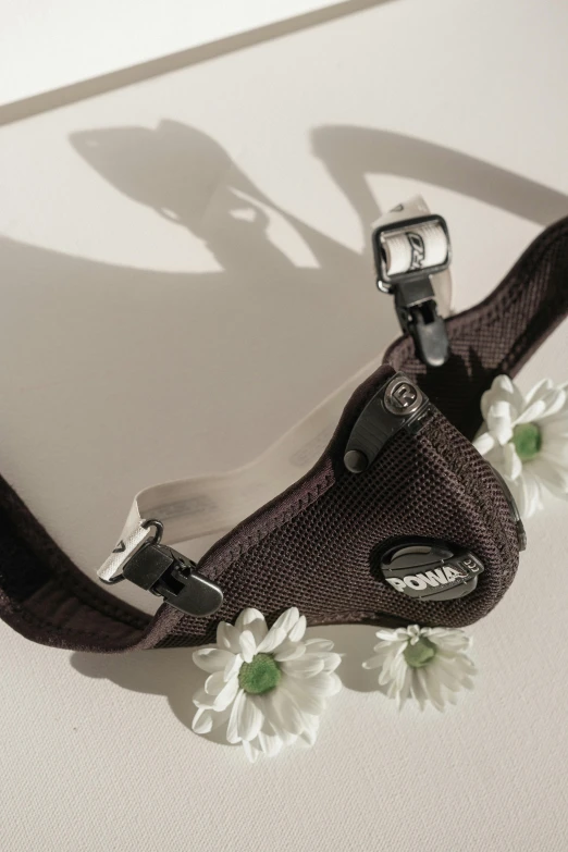 a purse with flower design and matching strap