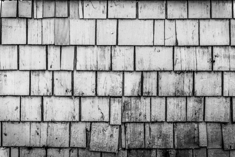 a roof with multiple wood shingles is shown