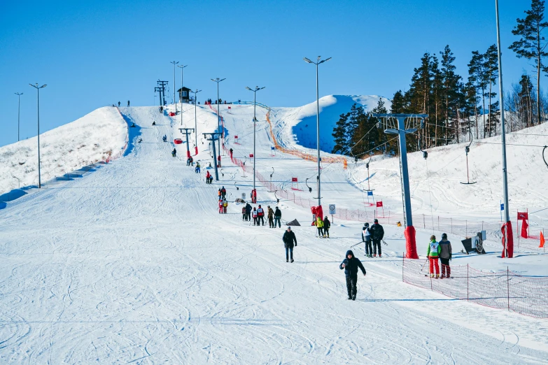 there are many people that is skiing down the mountain