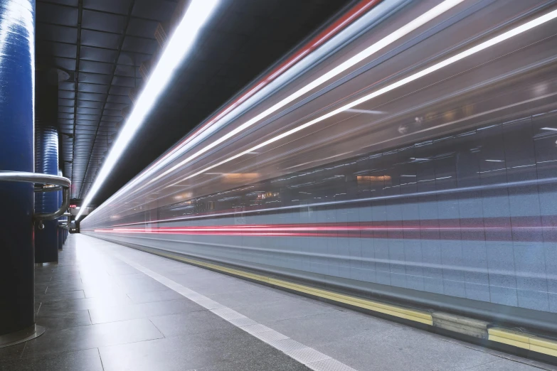 a train traveling through a tunnel filled with lots of lights