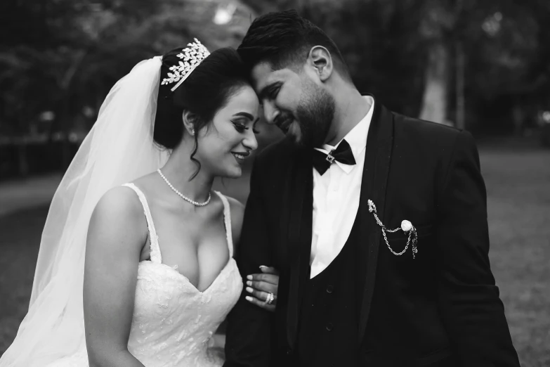 black and white image of a newly married couple in the woods