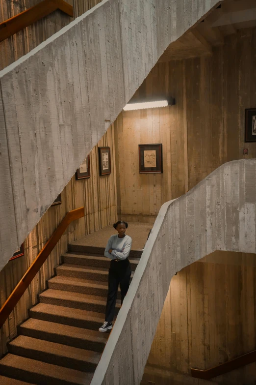 a man standing at the bottom of a stairway