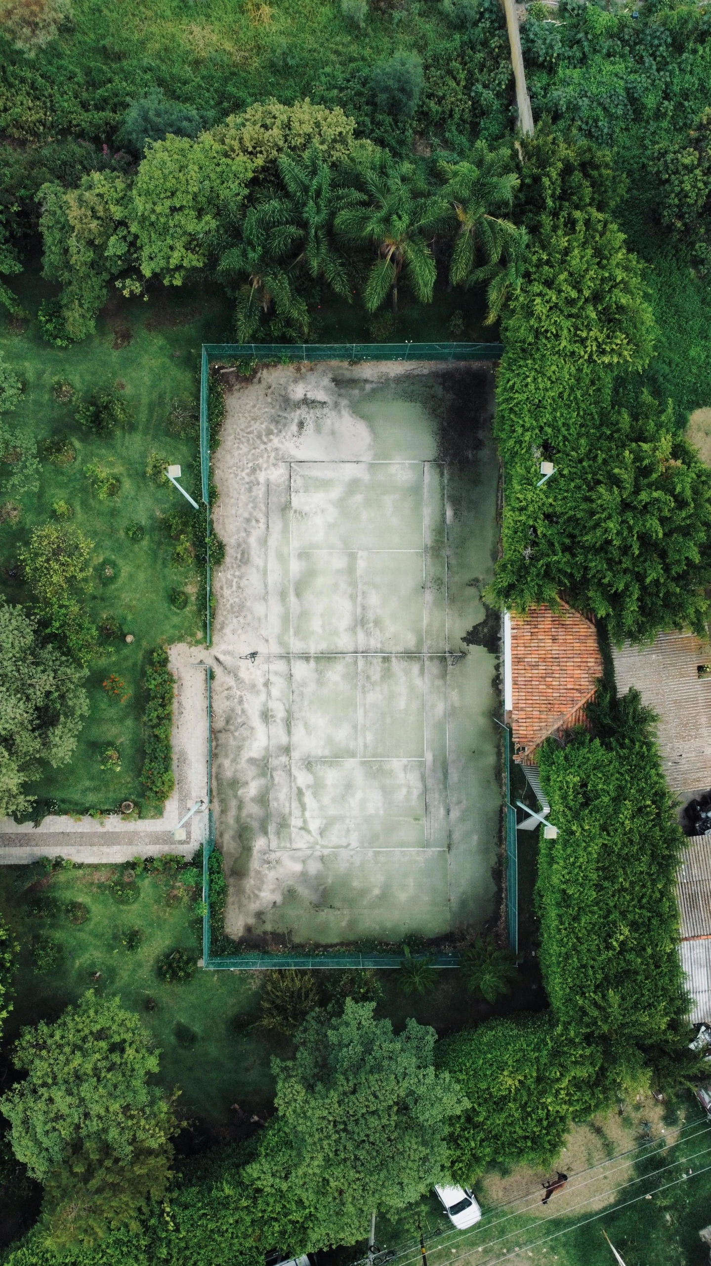 an aerial view of a large green and yellow basketball court