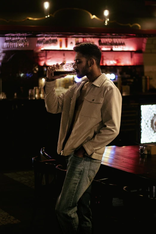 a man holding a beer with his hands