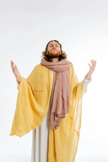 the jesus appears to be wearing a veil and holding his hands out