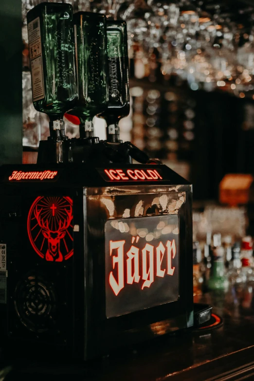 a black square box containing three bottles of beer