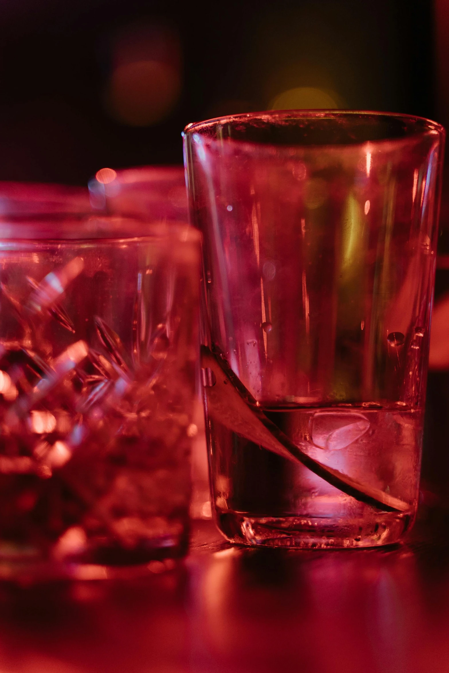 a close up of a glass of water on a table