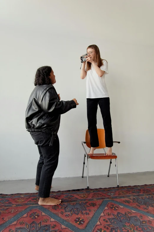 two people standing around and talking