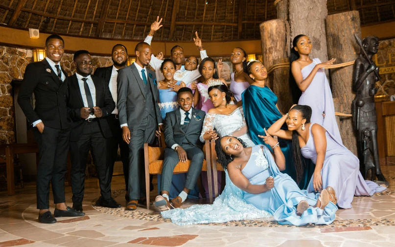 a group of people in dress wear posing for a picture