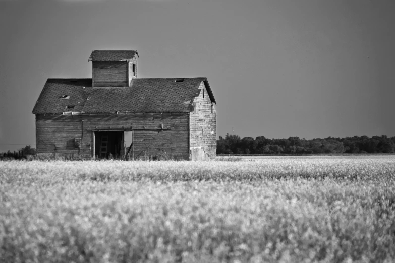 a black and white po of a old abandoned barn