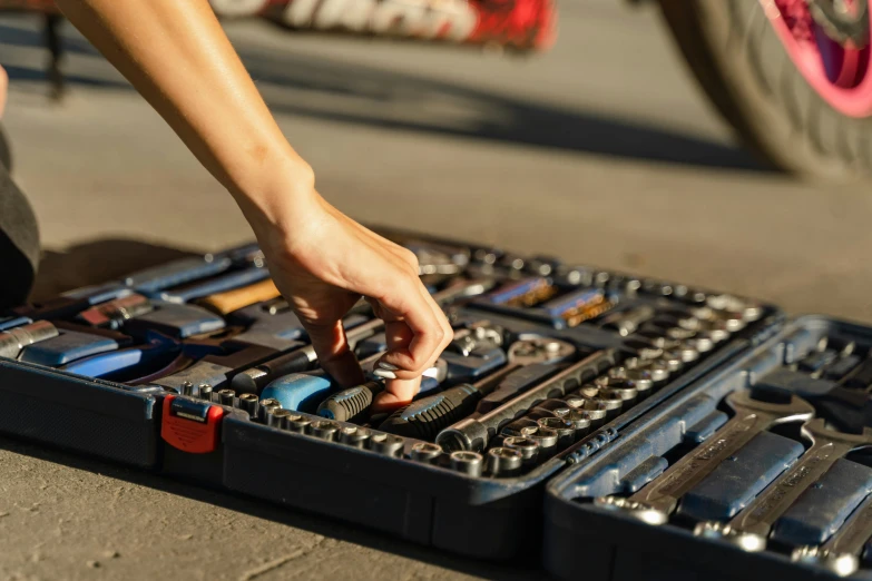 the tool case has tools in it on the ground