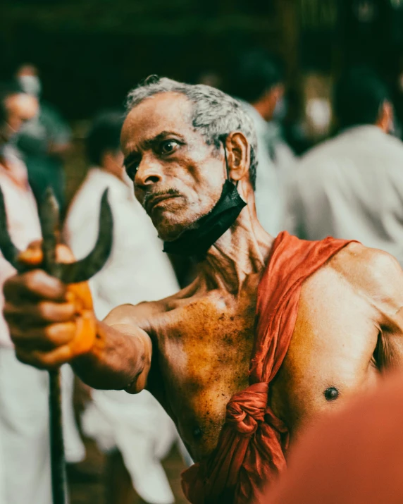 man with very large axe, possibly a man with only his shirt off