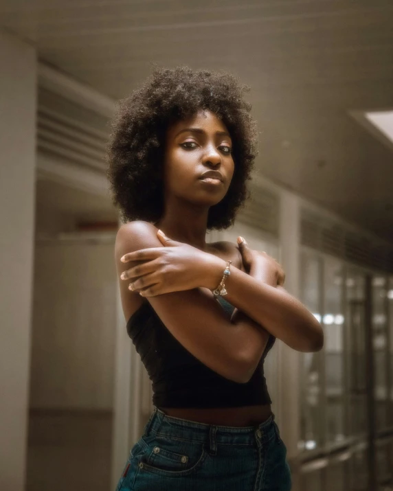 an african american woman leaning forward in the hallway