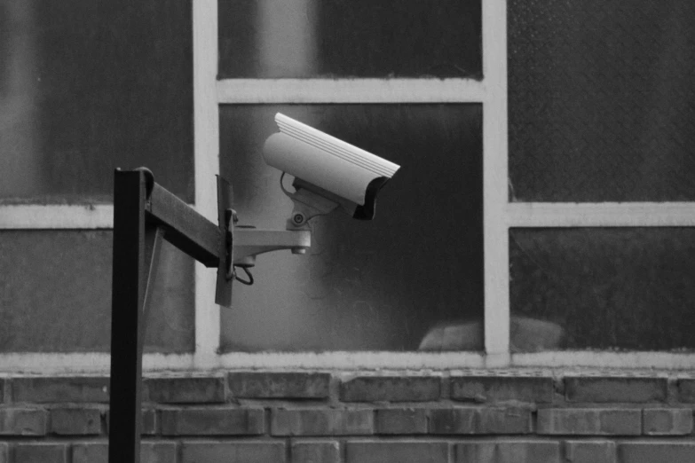 a security camera is seen outside an window