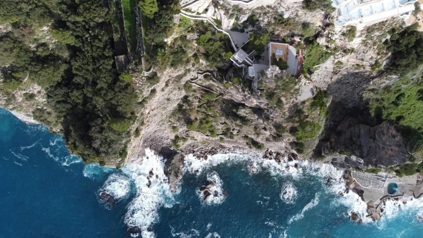 an aerial view of a cliff with many houses