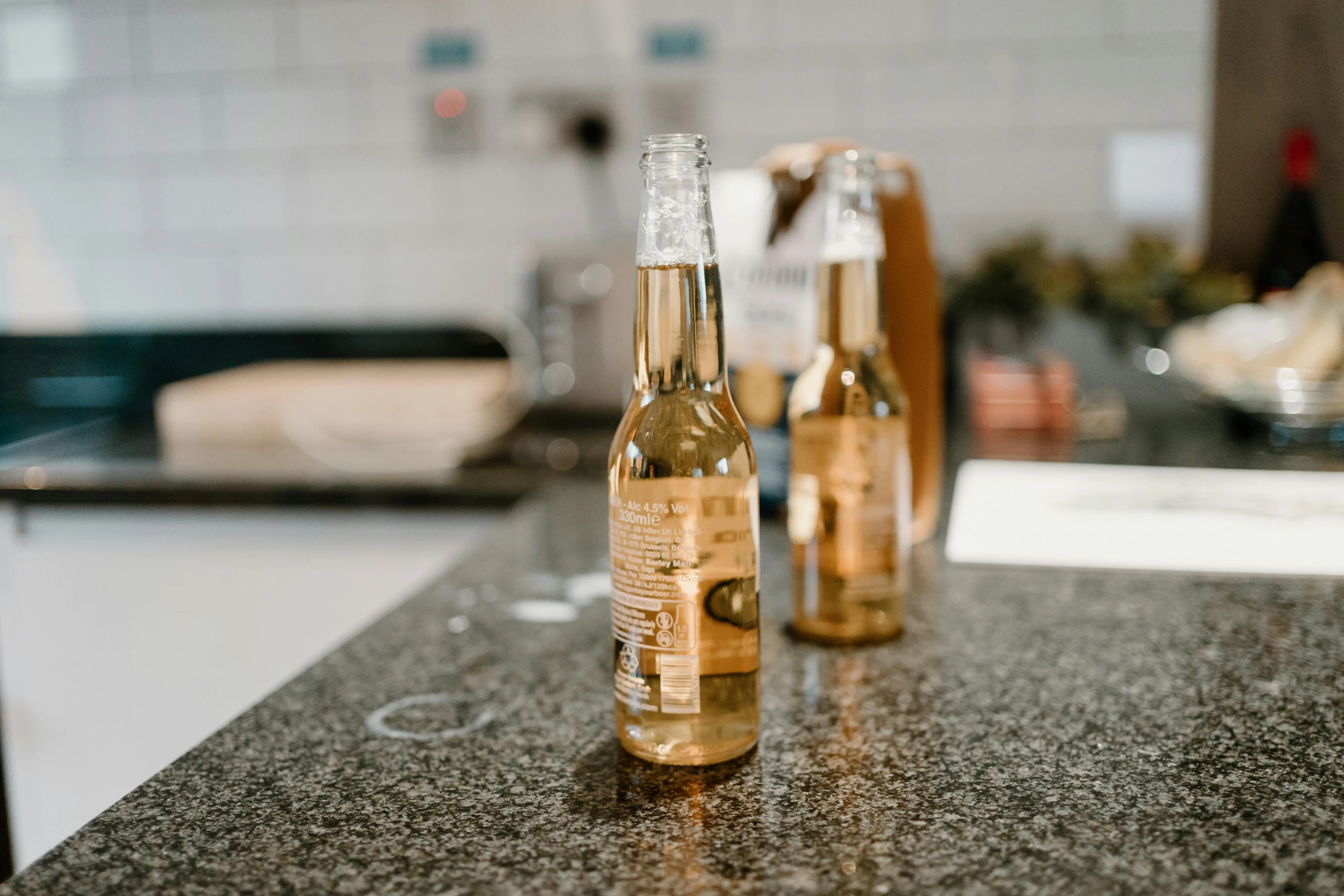 there are two bottles on the counter in the room