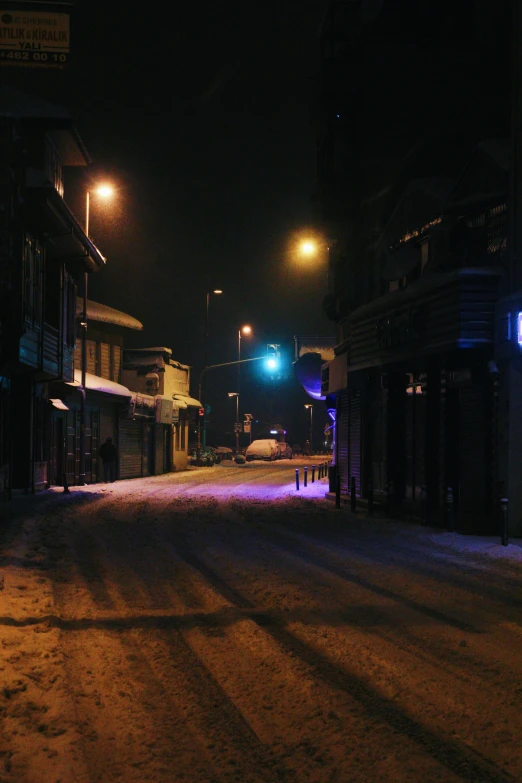 night scene of city street with no lights at intersection