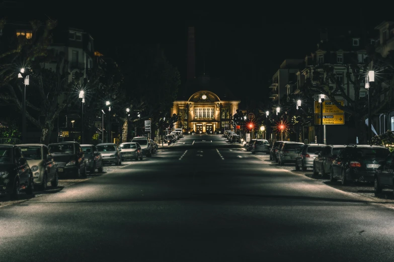 an empty city street at night during the day