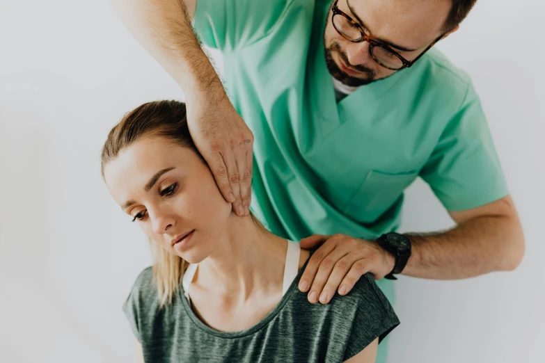 woman getting physical therapy with her doctor