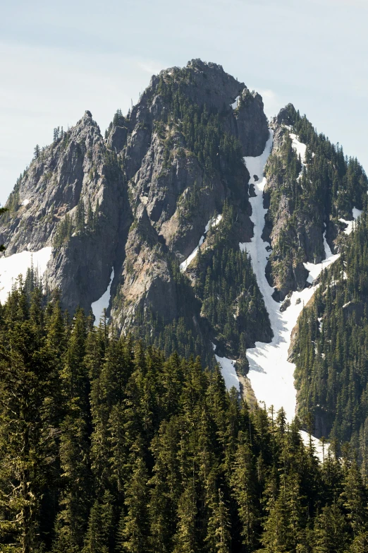 a view of several different mountains from the ground