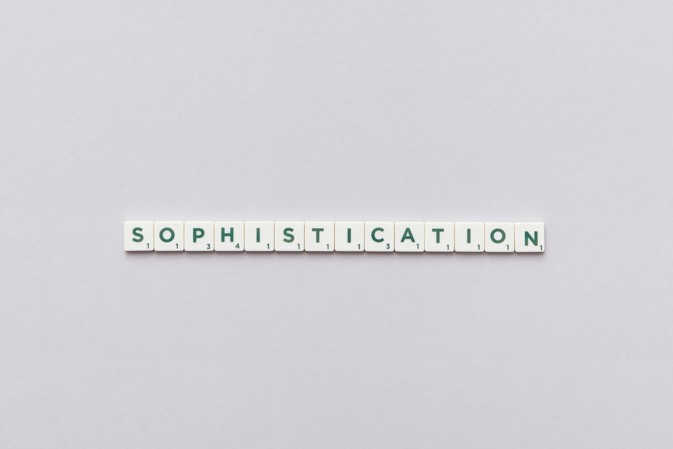 a scrabbled piece with words saying sophistictation on the side