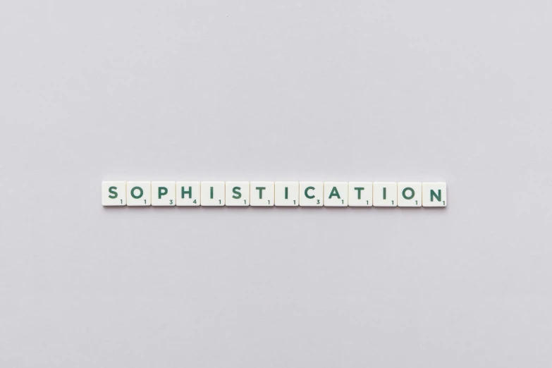 a scrabbled piece with words saying sophistictation on the side