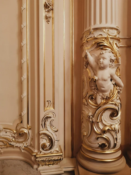 there is a golden and marble decor in the corner