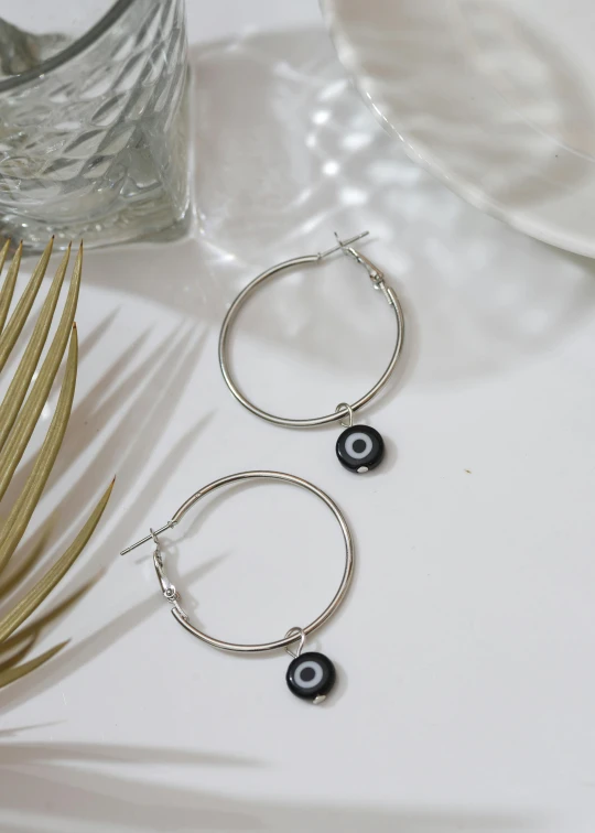 a couple of earrings that are on a table