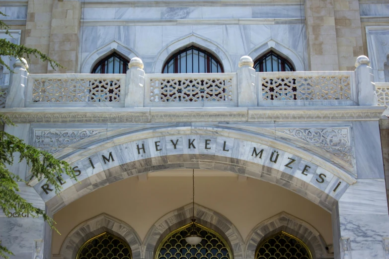 there is a large archway with intricate windows on it