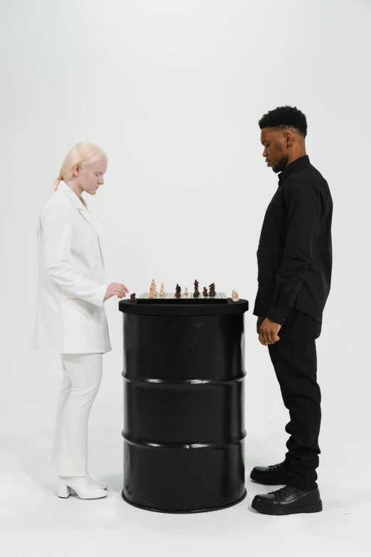 a man and a woman playing chess together