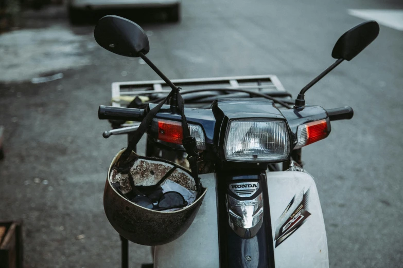 a motorcycle with its front light and helmet