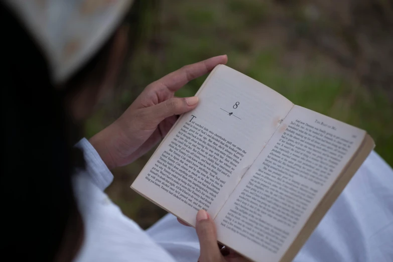 a person holding a book in their hands